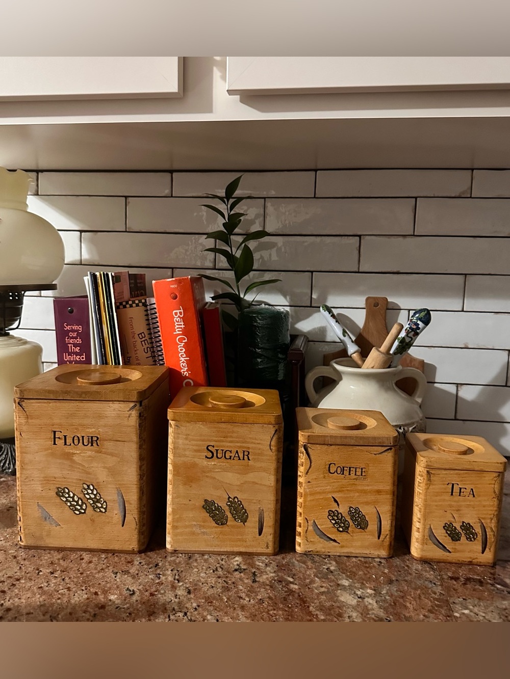Vintage wooden set of 4 canisters. Good condition